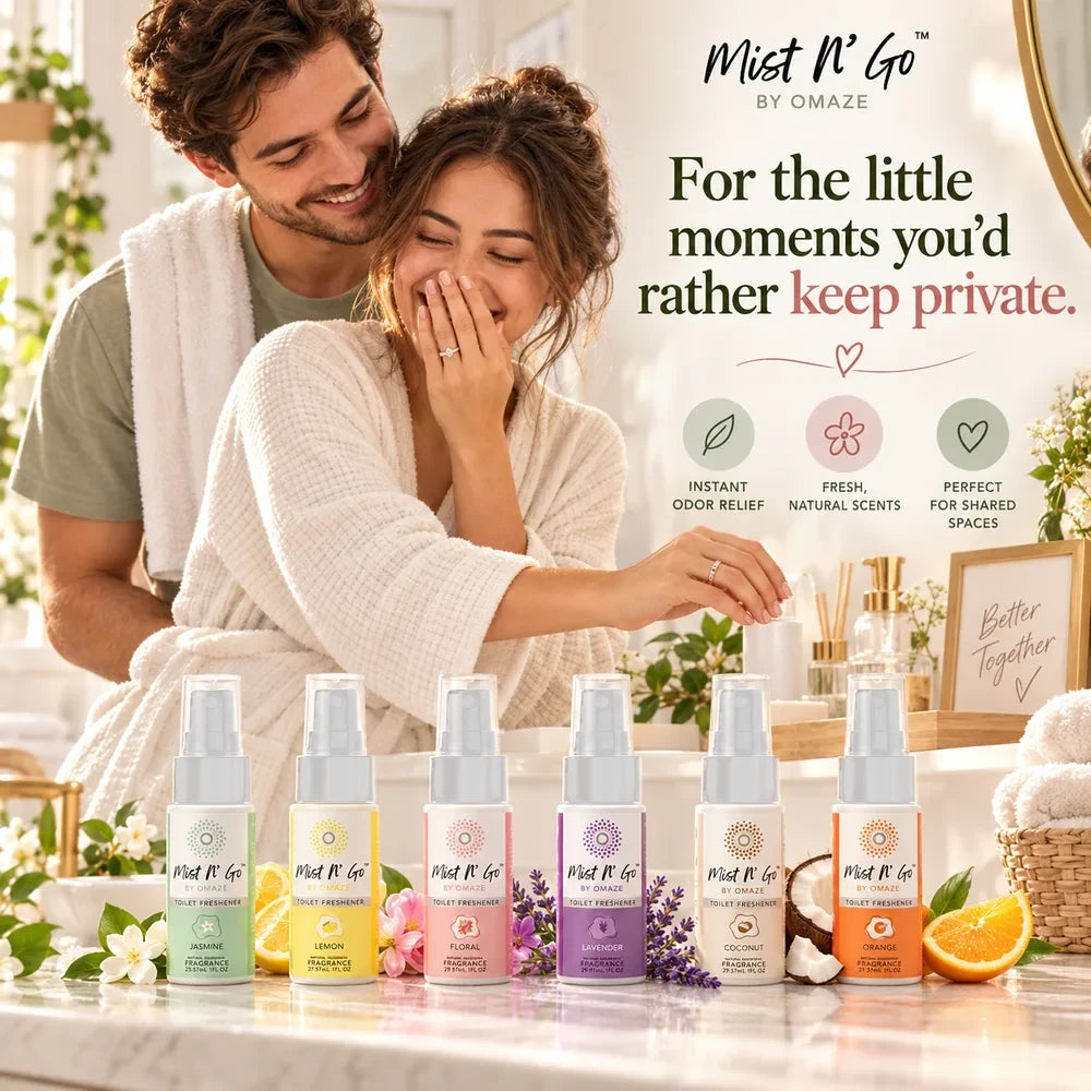 Couple laughing in a bathroom with the six scents on the counter